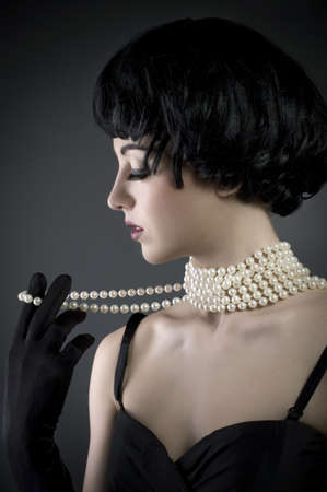 portrait beautiful brunette girl on a black background の写真素材