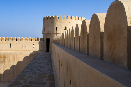 Historic adobe fortification, watchtower of Sunaysilah Castle or Fort in Sur, Al Sharqiya Region. Sultanate of Oman, Middle East のeditorial素材