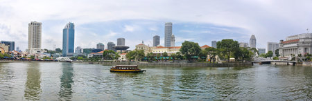 SINGAPORE-AUG 21:  Elgin Bridge is a vehicular bridge across the Singapore River  and suspension Cavenagh Bridge spanning the lower reaches of the Singapore River in the Downtown Core Singapore's Central Area on Aug 21, 2011のeditorial素材