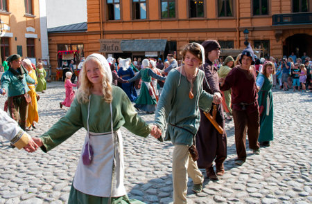 TURKU, FINLAND 30 JUNE  The Medieval Market of Turku is historical reenactment event and includes a handicrafts market with participants garbed in period costumes, on june 30, 2013 in Turku, Finland のeditorial素材