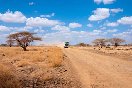 Car with people in the African desertの写真素材