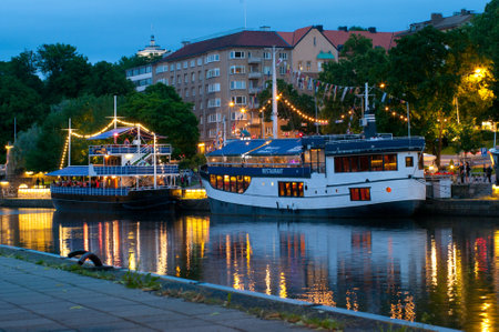 TURKU, FINLAND 29 JUNE  View to the Aura river at night in Turku,Finland on 29 june, 2013  Nightlife on the banks of river Aura, where are bars and restaurants  Turku is  one of popular tourist destinations  のeditorial素材