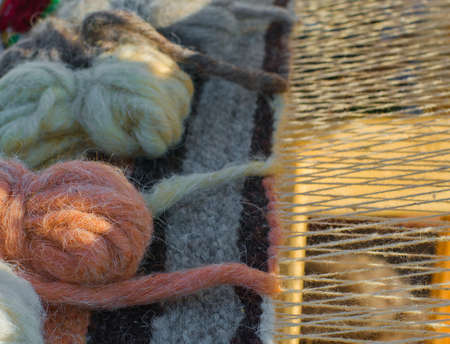 Part of vintage wooden loom with  homemade threads  の写真素材