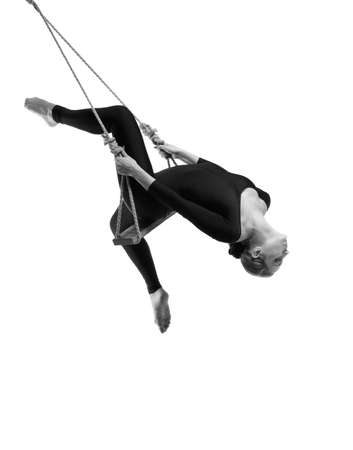 Young woman gymnast on rope on white , Black and whiteの写真素材