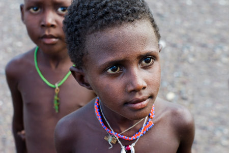 LAKE TURKANA, KENYA- JAN 12: African unidentified El molo child, 7 years old on Jan 12, 2013 in tribal village near lake Turkana, Kenya.The El molo are one of the disappearing tribes of Africaのeditorial素材