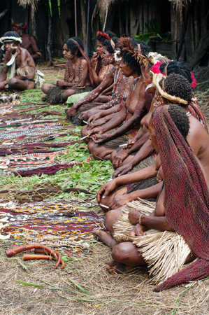 PAPUA PROVINCE, INDONESIA-DEC 28:  People of Papuan tribal sell traditional souvenirs in village near Wamena, on New Guinea Island, Indonesia on Dec 28, 2010. のeditorial素材
