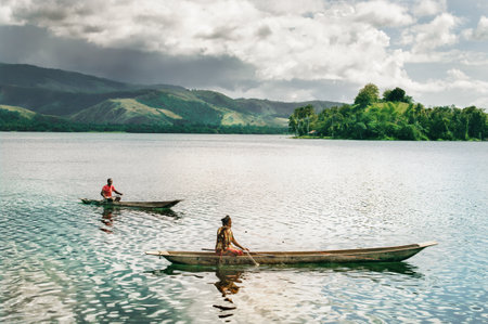 LAKE SENTANI, INDONESIA - JAN 08: Fishermans catch a fish January 8, 2011 at Lake Sentani, Island New Guinea, Indonesia.のeditorial素材