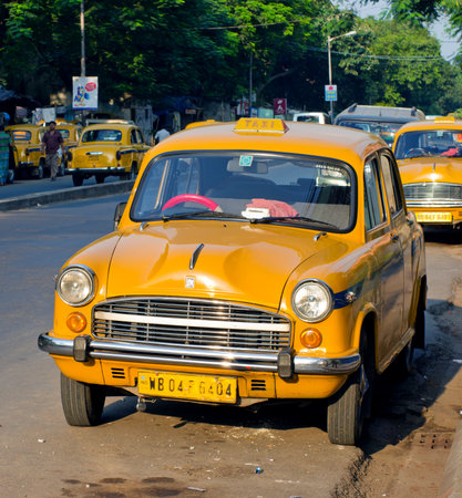 KOLKATA (CALCUTTA),  INDIA - OCTOBER 06: Yellow taxi cabs on October 06, 2014  in Kolkata, India.のeditorial素材