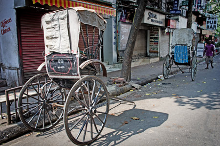 KOLKATA (CALCUTTA),  INDIA - OCTOBER 06: Traditional hand pulled indian rickshaw parked on the street on October 06, 2014 in Kolkata, India.のeditorial素材