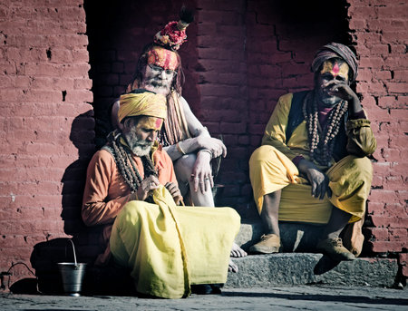 KATHMANDU, NEPAL - MARCH 03: Sadhu with traditional painted face at Pashupatinath Temple in Kathmandu, Nepal on March 03, 2014.のeditorial素材