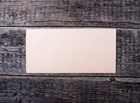 Blank card  on old wooden backgroundの写真素材