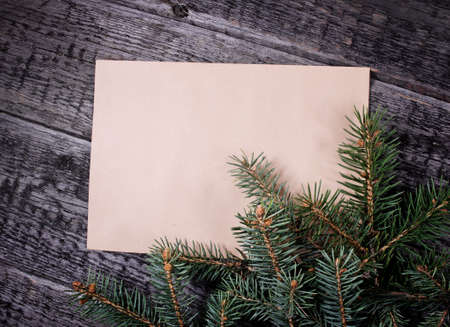 Card with  Christmas tree on wooden backgroundの写真素材