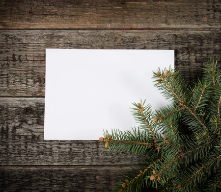 Card with  Christmas tree on wooden background