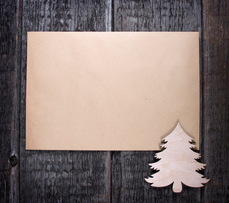 Card with  Christmas tree on wooden backgroundの写真素材
