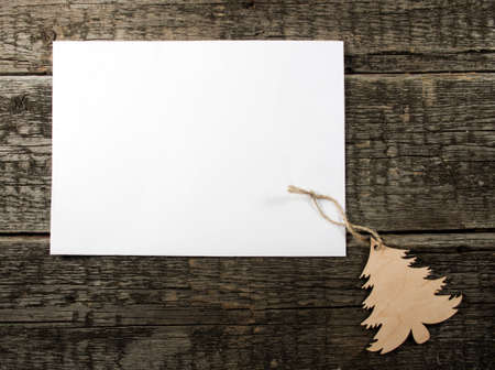 Card with  Christmas tree on wooden backgroundの写真素材