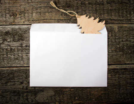 Card with  Christmas tree on wooden backgroundの写真素材