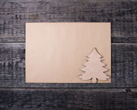 Card with  Christmas tree on wooden backgroundの写真素材