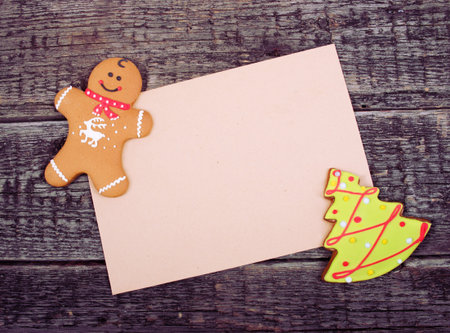 Card with Christmas decoration on wooden backgroundの写真素材