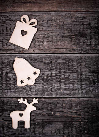 Card with Christmas decorations on wooden backgroundの写真素材