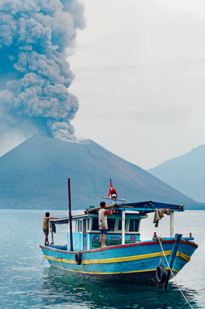 INDONESIA - JANUARY 20:  Boat near volcano Anak Krakatau during  eruption on January 20, 2011.のeditorial素材