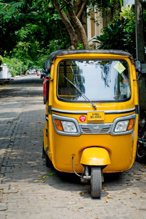 PONDICHERRY (PUDUCHERRY), INDIA - OCT 12, 2014: Auto rickshaw or tuk-tuk on the street  in Pondicherry also known as Puducherry, India, on 12 Oct 2014のeditorial素材