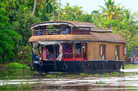Kerala, India - October 18: Traditional Indian houseboat near Alleppey  on Kerala backwaters on October 18, 2014.のeditorial素材