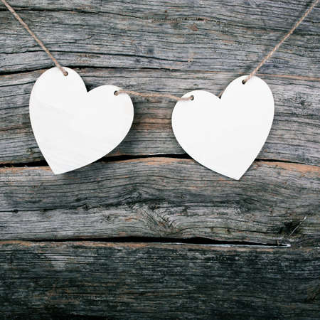 postcard with hearts on a wooden backgroundの写真素材
