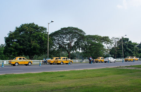 KOLKATA (CALCUTTA), INDIA - OCTOBER 06: Yellow taxi cabs on October 06, 2014 in Kolkata, India.のeditorial素材