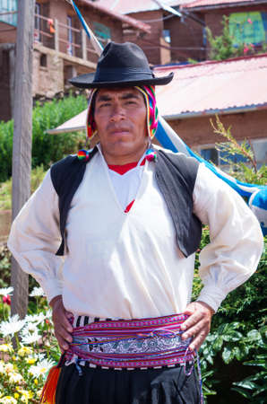 TAQUILE, PERU - MARCH 20, 2015:Man in  traditional clothes at Taquile Island at lake Titicaca in Peruのeditorial素材