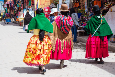 Copacabana, Bolivia-March 23, 2015:Bolivian  women in traditional clothes on the street Copacabana.のeditorial素材