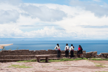 TAQUILE, PERU - MARCH 20, 2015:Men in  traditional clothes at Taquile Island at lake Titicaca in Peruのeditorial素材