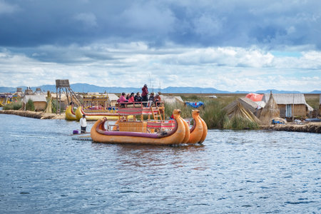 TITICACA, PERU, MARCH 19, 2015: Traditional village on floating Uros  islands on lake Titicaca in Peru, South Americaのeditorial素材