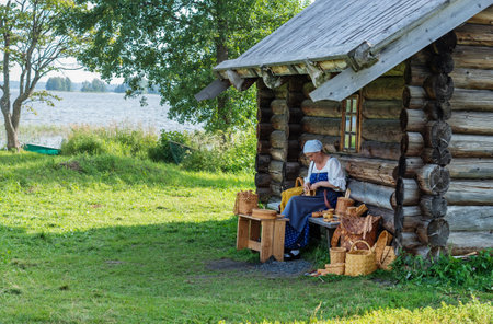 KIZHI, RUSSIA -  AUG 07, 2015: Women in traditional russian costume   in Historico-architectural museum Kizhi on Kizhi island, Karelia, Russia.のeditorial素材