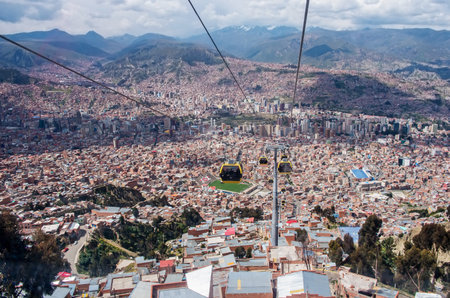 LA PAZ, BOLIVIA - APR 03, 2015: Cable cars carry passengers in La Paz. Aerial cable car of urban transit system opened in 2014 in the Bolivian city of La Paz.のeditorial素材