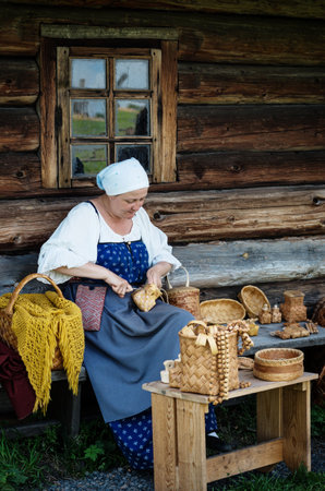 KIZHI, RUSSIA -  AUG 07, 2015: Women in traditional russian costume   in Historico-architectural museum Kizhi on Kizhi island, Karelia, Russia.のeditorial素材