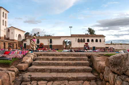 CHINCHERO, PERU - MARCH 9, 2015: Peruvian women dressed in traditional clothes at local marketのeditorial素材