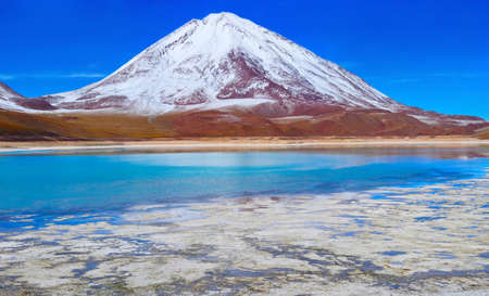 volcano Licanabur and Laguna Verde. Eduardo Avaroa Andean Fauna National Reserve, Boliviaの写真素材