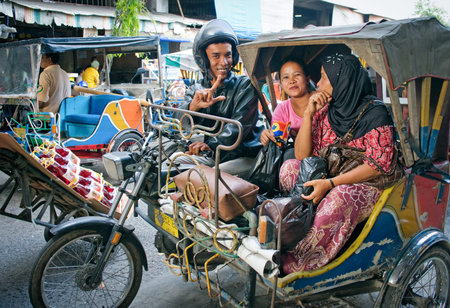MEDAN, INDONESIA - AUG 11: Auto rickshaw taxi on on Aug 11, 2011 in Medan, Indonesia. These taxis...