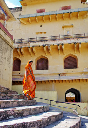JAIPUR, RAJASTHAN, INDIA - SEPT 26, 2013: Woman in traditional clothes in Amber Fort on September 26, 2013 in Jaipur, Rajasthan, India.のeditorial素材
