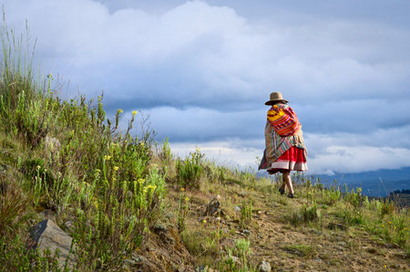 HUARAZ, PERU - APR 20: Peruvian woman in mountains on Apr 20, 2015 in Huaraz, Peru