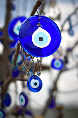A nazar, charms to ward off the evil eye , on the branches of a tree in Cappadocia, Turkey