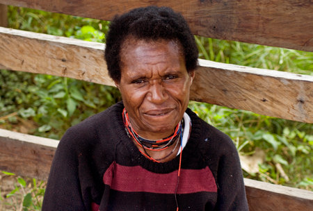 PAPUA PROVINCE, INDONESIA -January 2011: A traditional papua woman at the market in Wamena at New Guinea Island.のeditorial素材