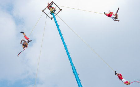 Mexico City, Mexico - November 15, 2016: Danza de los Voladores (Dance of the Flyers)- flying men performing the "voladores" ritual in Chapultepec in Mexico Cityのeditorial素材