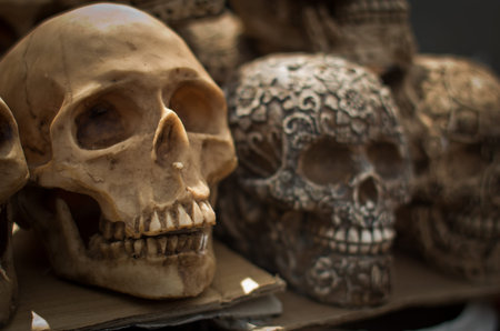 Decorated skulls, ceramics death symbol at market, day of dead, Mexico
