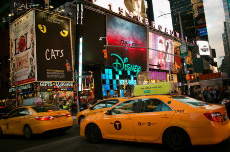 New York City, USA - October 13, 2016: New York yellow cabs going through Time Square. Times Square is an one of iconic street of New York City and America.のeditorial素材
