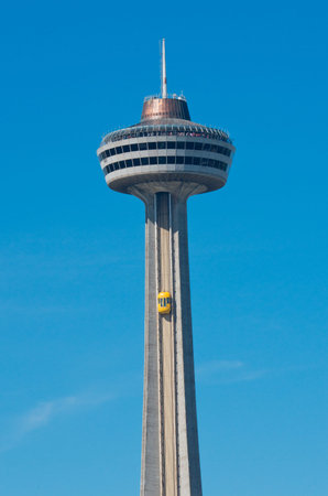 Niagara Falls, Canada - September 25, 2016: Skylon tower with yellow elevator against a blue sky in Niagara Falls, Canada.のeditorial素材