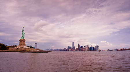 Statue of Liberty and Manhattan skyline panorama., New York Cityの写真素材