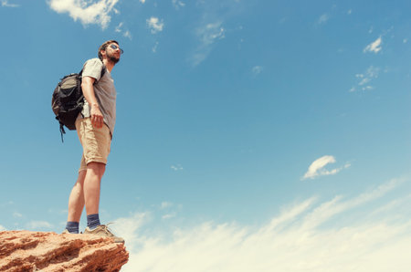 Hiker in mountains against sky