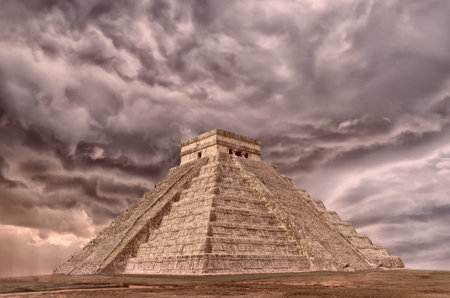 Ancient Pyramid in Chichen Itza against a dramatic sky. Temple of Kukulkan. Yucatan, Mexico