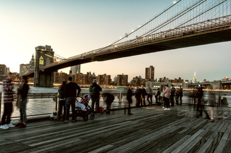 New York City, October 14, 2016: View on famous Brooklyn Bridge gate and walking people in New York, USAのeditorial素材